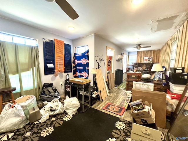 interior space with ceiling fan and wood finished floors