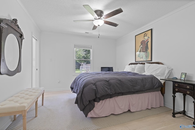 24961 Capshaw Rd, Athens, AL 35613 - bedroom with ornamental molding, a textured ceiling, a ceiling fan, and wood finished floors