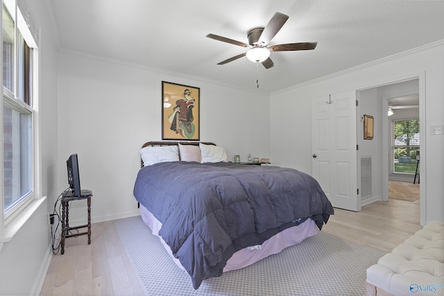 24961 Capshaw Rd, Athens, AL 35613 - bedroom with light wood finished floors, crown molding, and ceiling fan