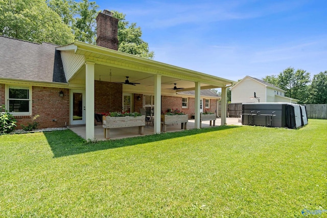 24961 Capshaw Rd, Athens, AL 35613 - rear view of property featuring a patio area, brick siding, ceiling fan, and a chimney