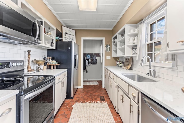 kitchen featuring white cabinetry, a sink, open shelves, and appliances with stainless steel finishes