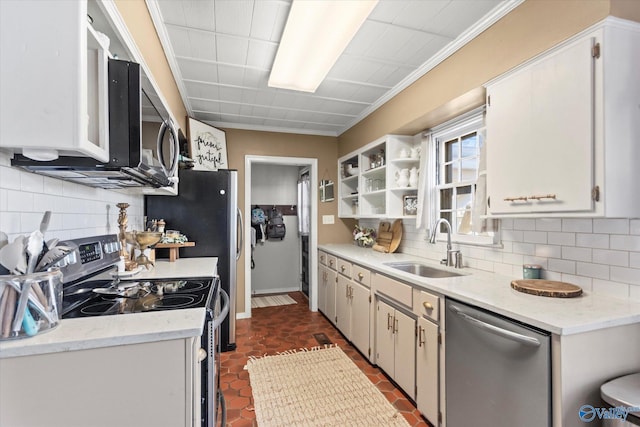 kitchen featuring open shelves, decorative backsplash, a sink, and stainless steel appliances