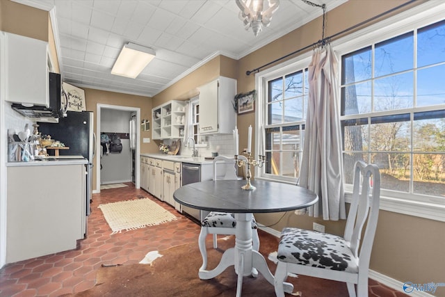 dining room with baseboards and ornamental molding