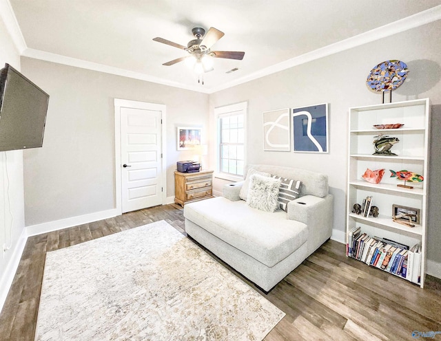 interior space featuring crown molding, ceiling fan, and wood-type flooring