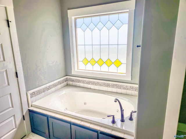 bathroom featuring tiled tub