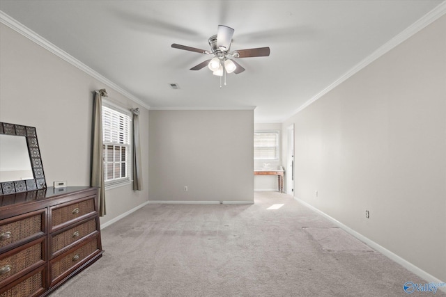 interior space with crown molding, light carpet, and multiple windows