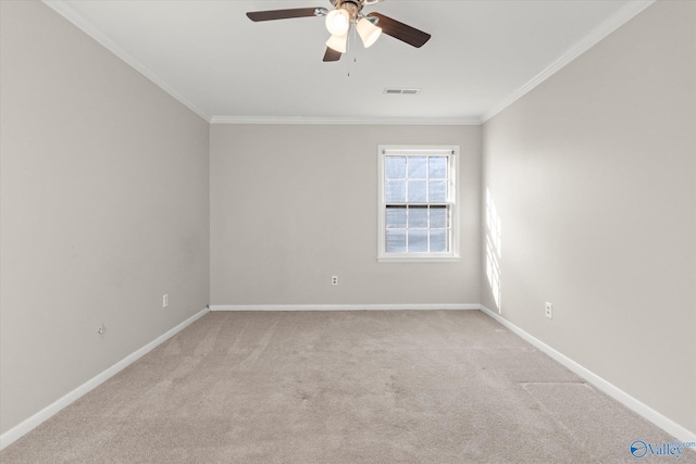 carpeted empty room featuring crown molding and ceiling fan