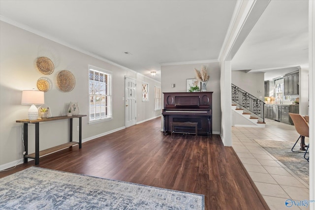 foyer featuring wood-type flooring and ornamental molding