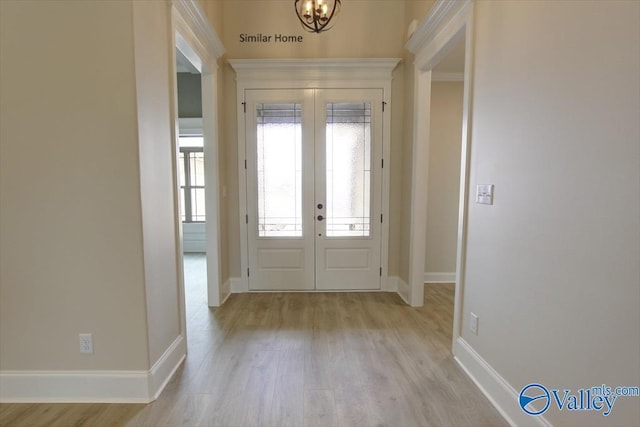 foyer with french doors and light wood-type flooring