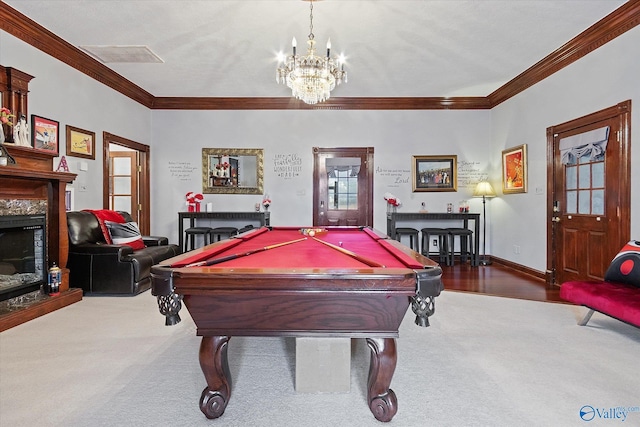 playroom with baseboards, a fireplace, visible vents, and crown molding