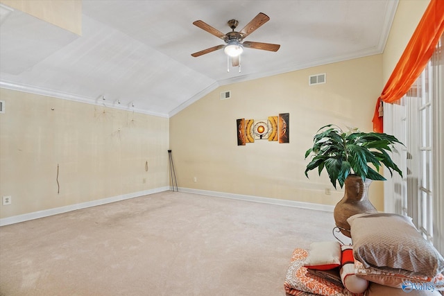 living area featuring lofted ceiling, ornamental molding, and visible vents