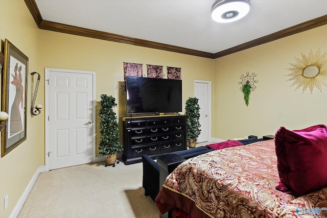 bedroom with crown molding, baseboards, and carpet flooring