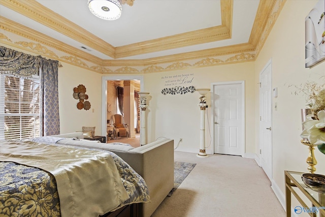 bedroom with crown molding, a tray ceiling, baseboards, and light colored carpet