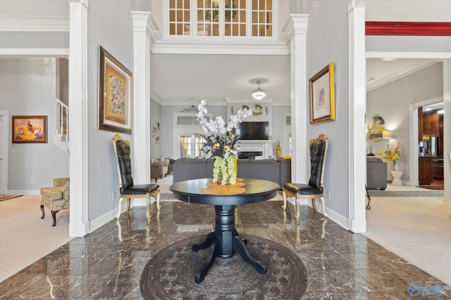 foyer with marble finish floor, stairs, baseboards, and crown molding