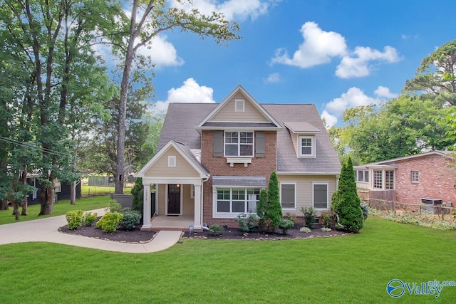 10016 Conrad Dr SE, Huntsville, AL 35803 - view of front of house with covered porch, a shingled roof, and brick siding