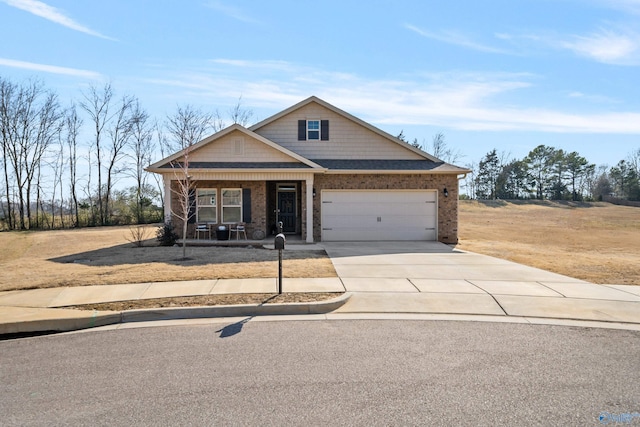 craftsman inspired home with a garage, brick siding, covered porch, and driveway