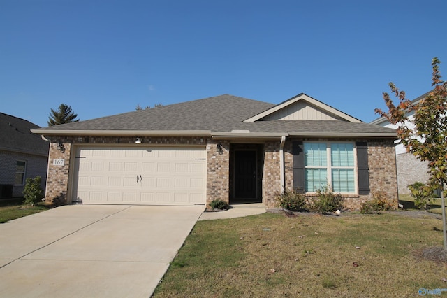 single story home featuring a garage and a front yard