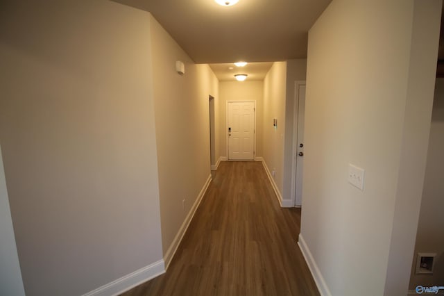 hallway featuring dark wood-type flooring