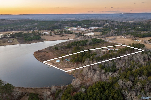 aerial view at dusk with a water view