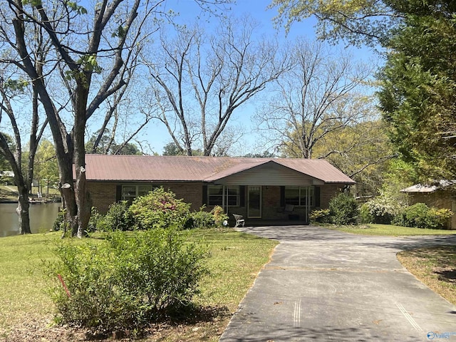 765 County Road 745, Cedar Bluff, AL 35959 - single story home featuring aphalt driveway, metal roof, and a front yard