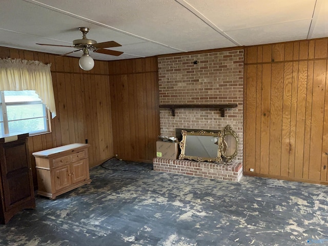 765 County Road 745, Cedar Bluff, AL 35959 - unfurnished living room featuring wooden walls, carpet flooring, a fireplace, and ceiling fan