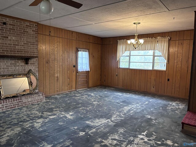 765 County Road 745, Cedar Bluff, AL 35959 - interior space with ceiling fan with notable chandelier, baseboards, and wood walls
