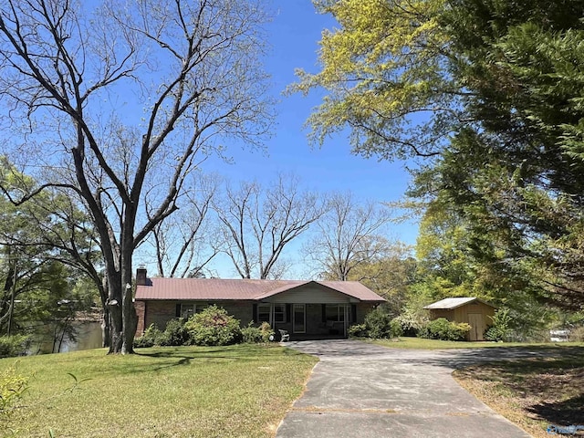 765 County Road 745, Cedar Bluff, AL 35959 - ranch-style home with a chimney, a front lawn, and aphalt driveway