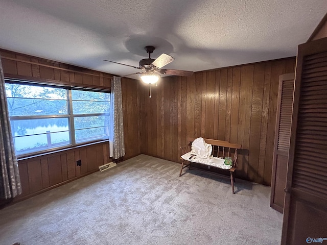 765 County Road 745, Cedar Bluff, AL 35959 - living area featuring a textured ceiling, visible vents, and wooden walls