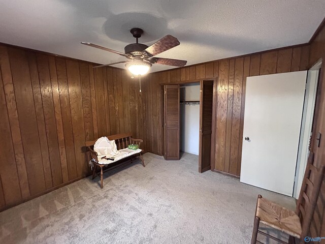 765 County Road 745, Cedar Bluff, AL 35959 - bedroom with ceiling fan, wood walls, a closet, and light carpet
