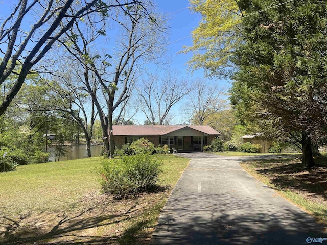 765 County Road 745, Cedar Bluff, AL 35959 - single story home with aphalt driveway and a front yard