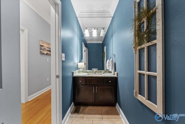 bathroom featuring track lighting, vanity, ornamental molding, and tile patterned flooring