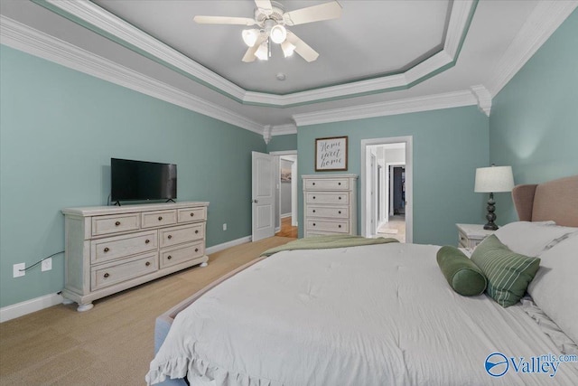 bedroom with ceiling fan, crown molding, a raised ceiling, and light colored carpet