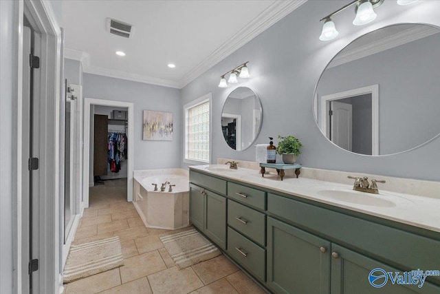 bathroom with crown molding, vanity, and a bathing tub