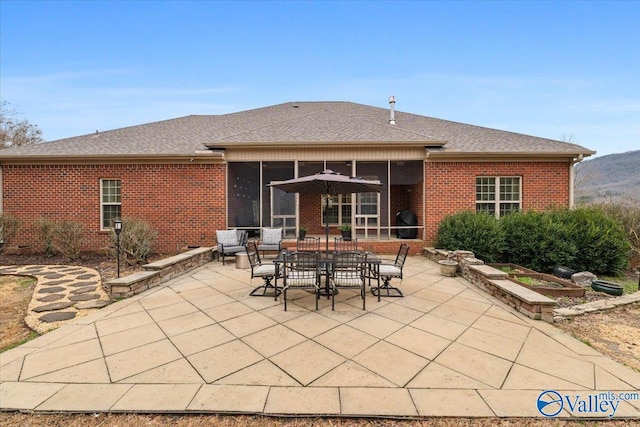 back of property with a patio area