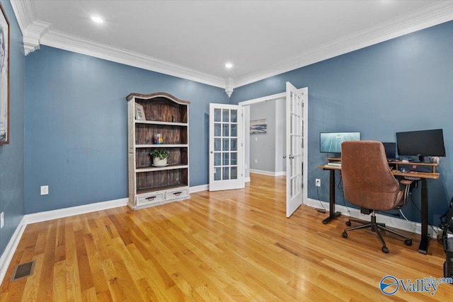 office area with french doors, crown molding, and light hardwood / wood-style flooring