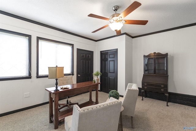 office space featuring baseboards, a ceiling fan, ornamental molding, and light carpet