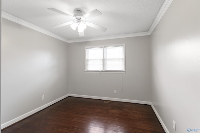 empty room with crown molding, visible vents, baseboards, dark wood-style flooring, and a ceiling fan