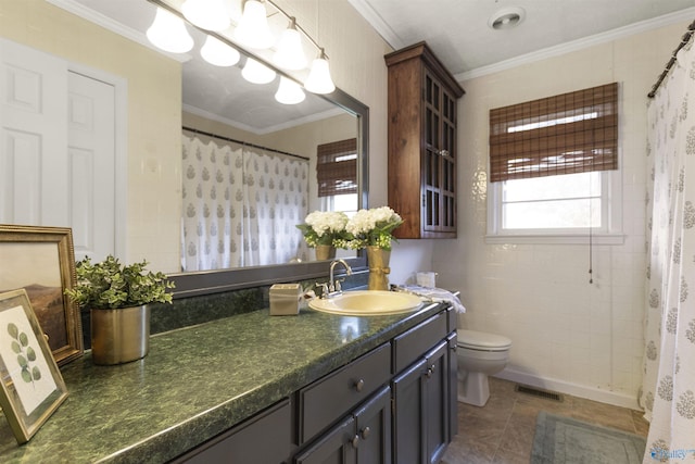 bathroom with a shower with curtain, vanity, toilet, visible vents, and ornamental molding