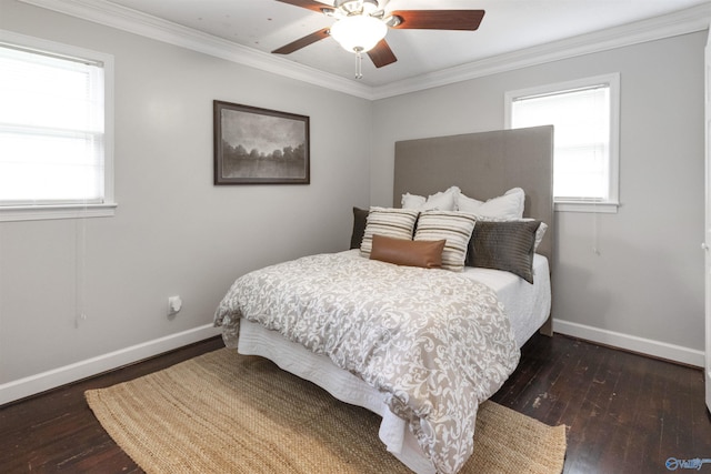 bedroom featuring multiple windows, baseboards, and wood-type flooring