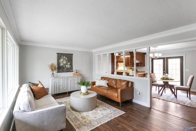 living room with a chandelier, crown molding, a textured ceiling, and dark wood-type flooring