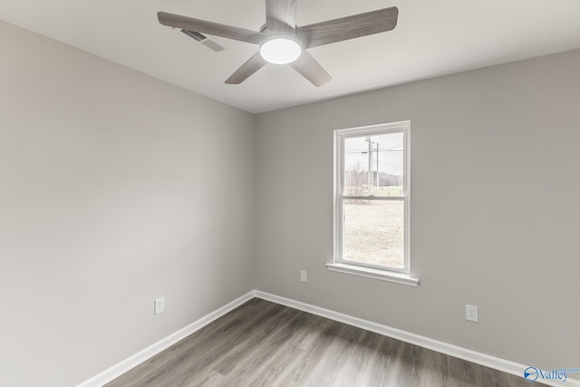 unfurnished room featuring hardwood / wood-style flooring and ceiling fan