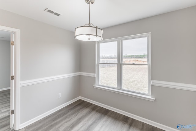 spare room featuring hardwood / wood-style flooring