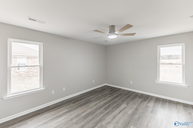 unfurnished room with ceiling fan and hardwood / wood-style floors