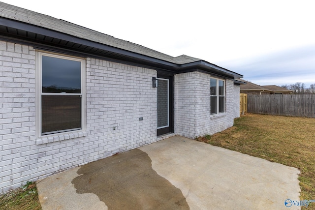 exterior space with a lawn and a patio area