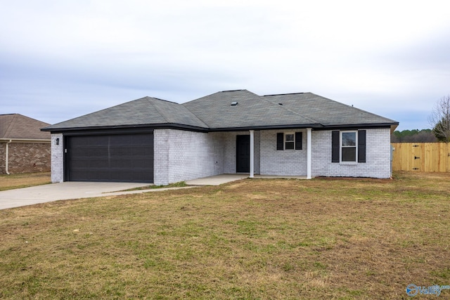 ranch-style house with a garage and a front lawn