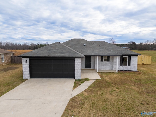 single story home featuring a front yard and a garage