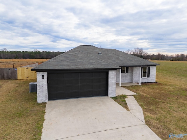 single story home with a front yard and central AC