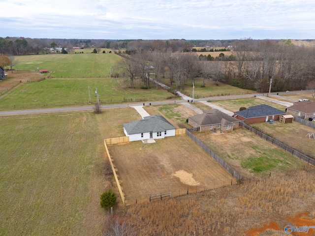 birds eye view of property with a rural view