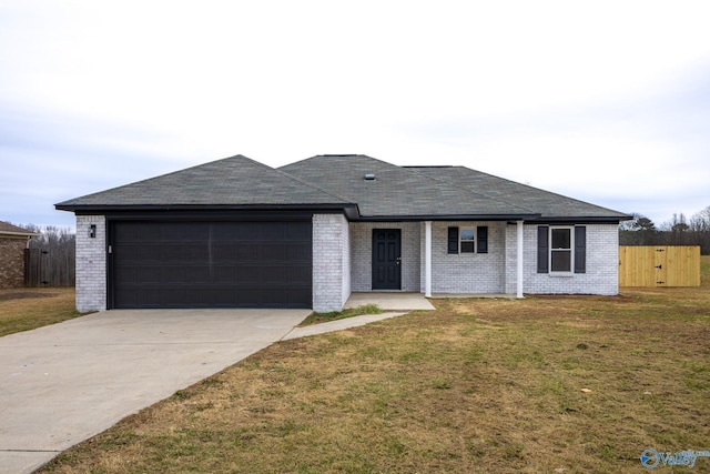 ranch-style house with a garage and a front yard