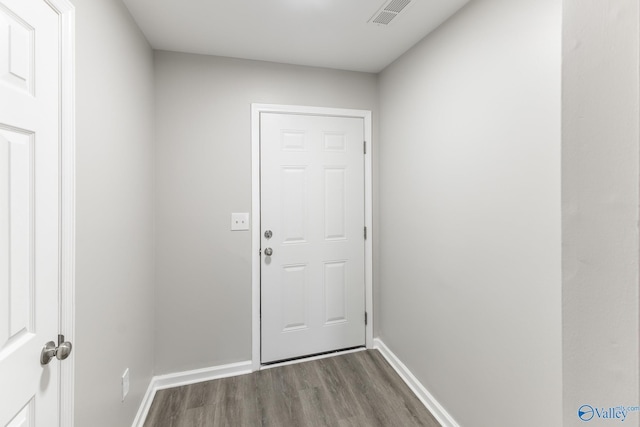 doorway featuring dark wood-type flooring